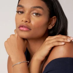 Four Station Two-Tone Knot Diamond Bangle Bracelet